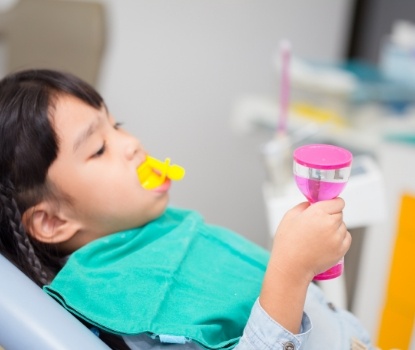 Child receiving fluoride treatment