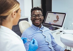 Man smiling at dentist during visit