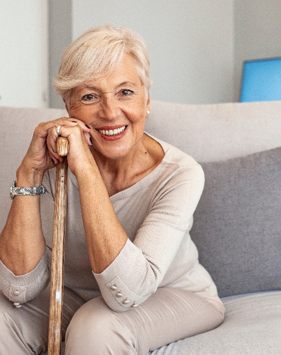 A smiling woman enjoying her dentures in Clarendon Hills