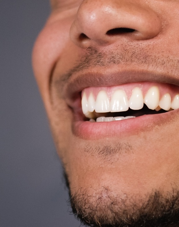 Closeup of healthy smile after gum disease treatment