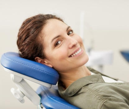 Woman in dental chair smiling