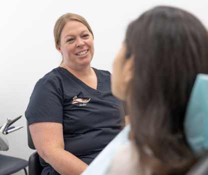 Woman smiling during dental checkups and teeth cleaning visit