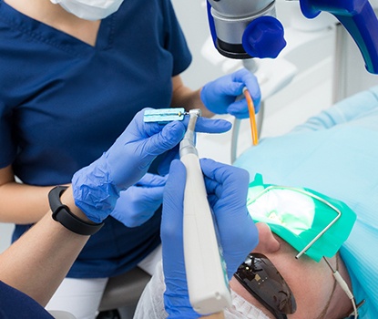Dentist preparing instruments to perform root canal