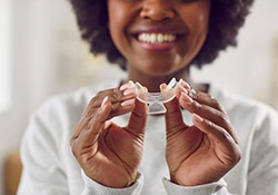 Woman holding a teeth whitening tray